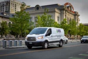 CCS van in motion driving past union station