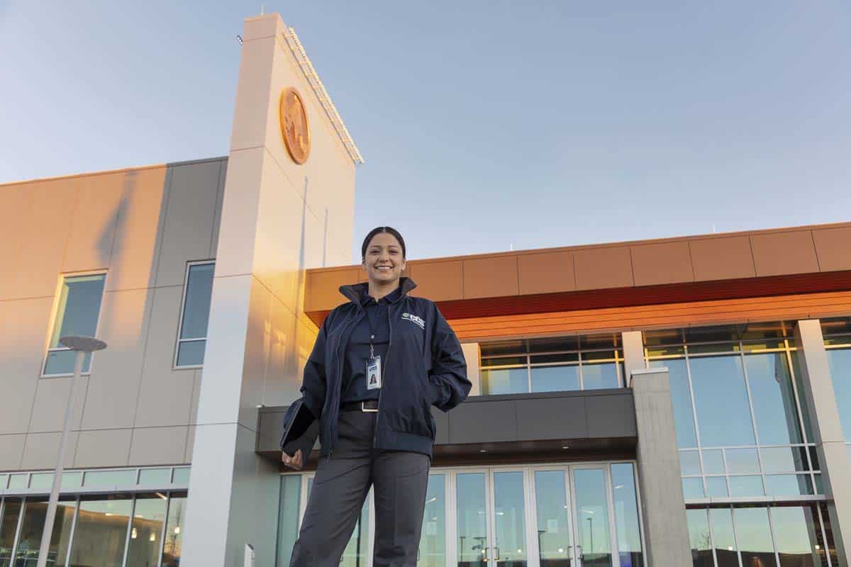 CCS employee standing outside of a government building