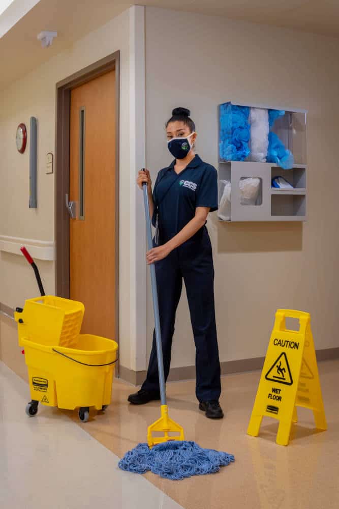 CCS Employee moping a hospital facility