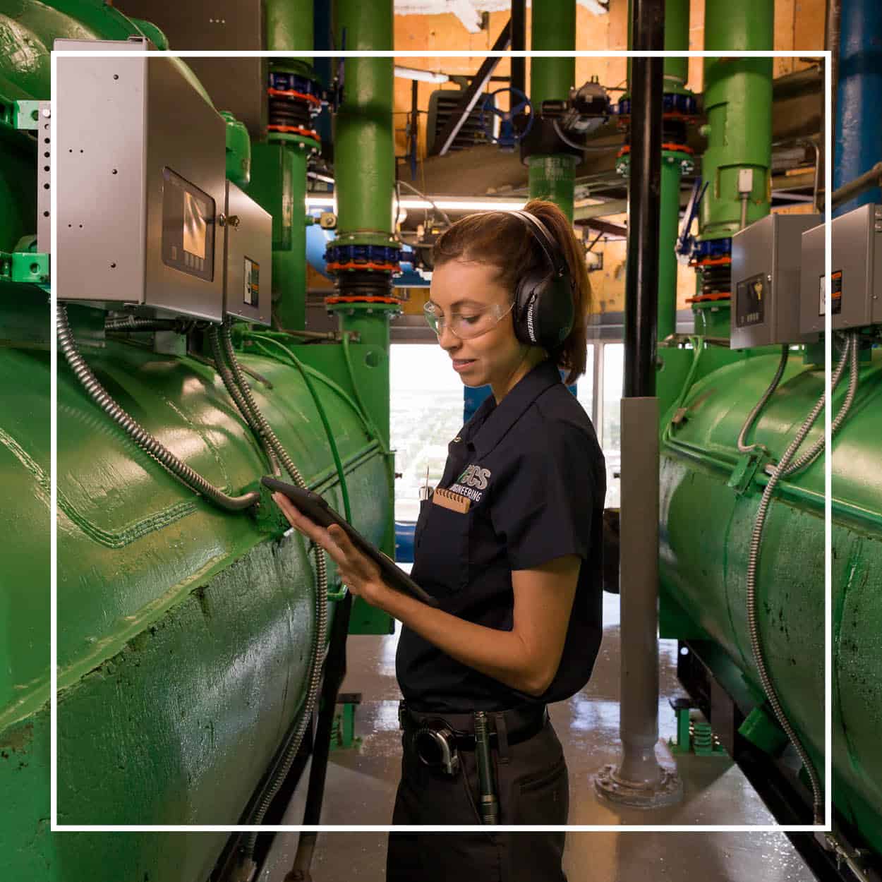 CCS engineer checking her ipad at an engineering plant