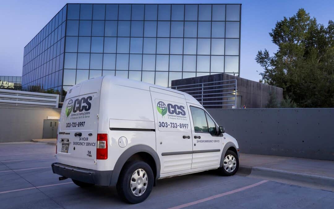 White CCS van parked outside in front of a building
