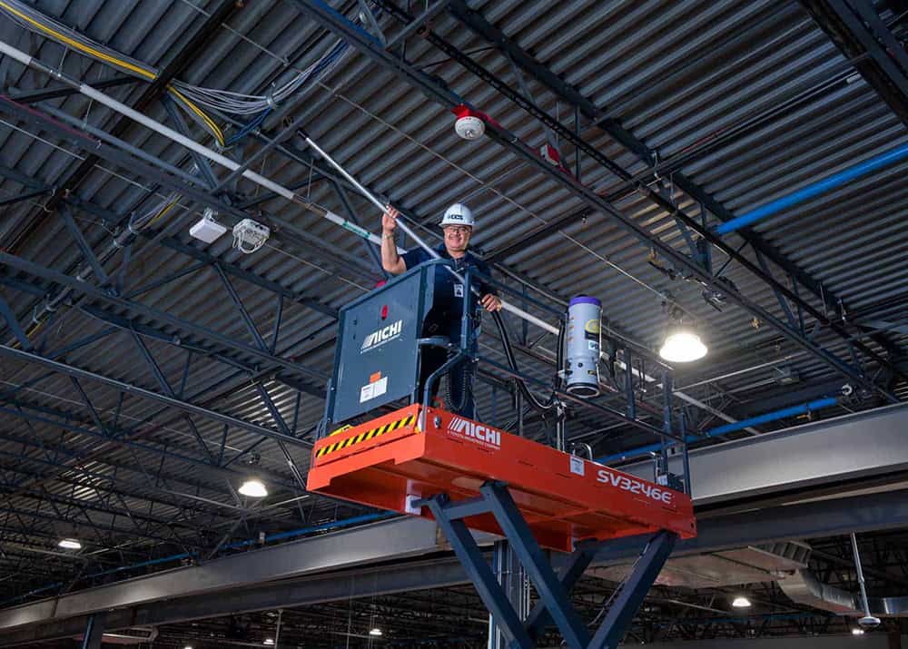 man cleaning industrial building